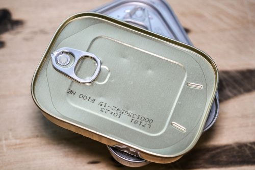 canned food on wooden surface